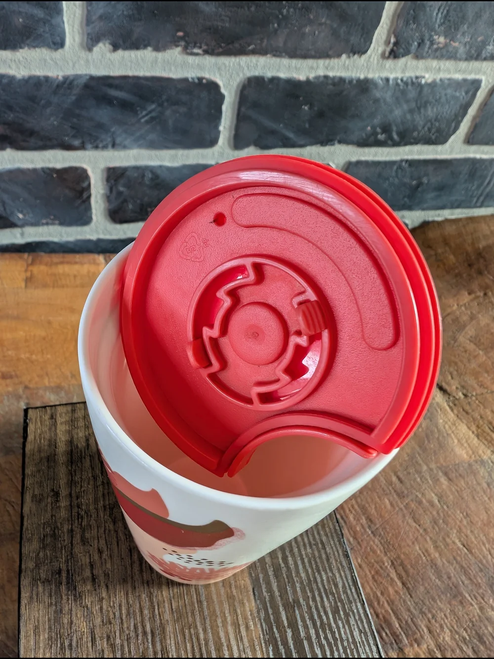 Starbucks White Ceramic Travel Mug with Coral Lid and Pinecone Accent